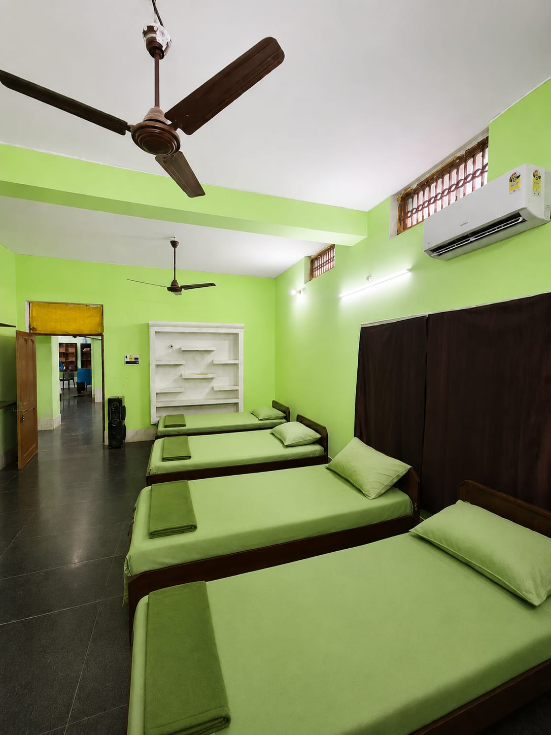 Updated shared residential room with beds and storage at Safe Zone Foundation